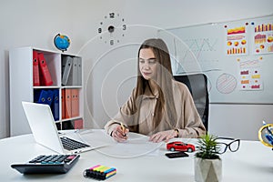 A female salesperson signs an agreement for the sale or lease of a car in the office