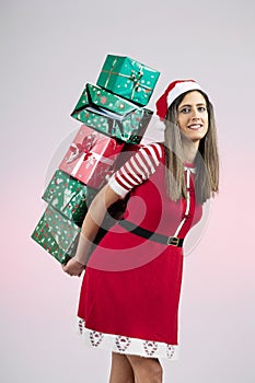 Female Santa holding pile of presents