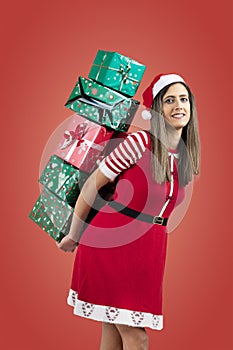 Female Santa holding pile of presents