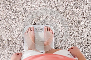 Female On Scale Measuring Weight Loss