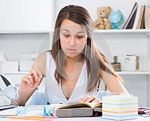Female schooler is preparing herself for exams