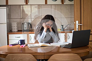 Female science student finding difficult to prepare for exams at home