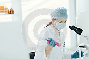 Female scientist conducts research in the laboratory.