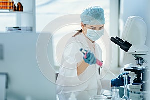 female scientist conducts research in the laboratory.