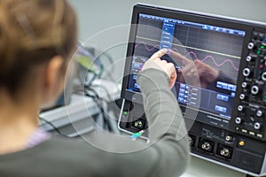 Female scientist doing research in a quantum optics lab