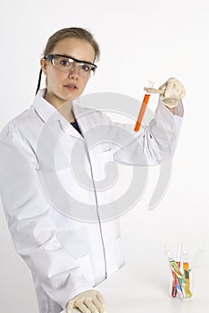 Female scientist examining a test tube