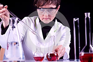 Female Scientist experimenting photo