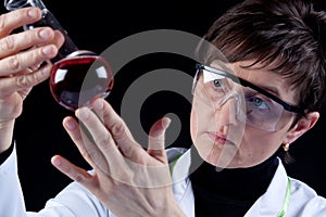 Female Scientist experimenting photo