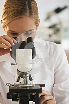 Female scientist with microscope