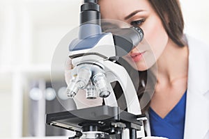 Female scientist with microscope
