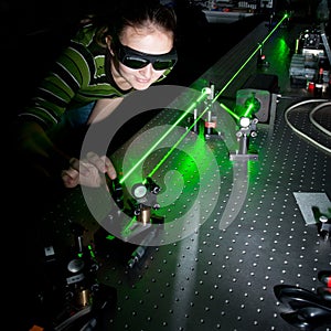 Female scientist in a quantum optics lab