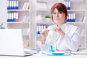 Female scientist researcher conducting an experiment in a labora