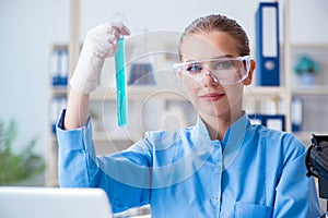 Female scientist researcher conducting an experiment in a labora