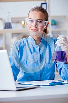 Female scientist researcher conducting an experiment in a labora