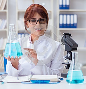 Female scientist researcher conducting an experiment in a labora