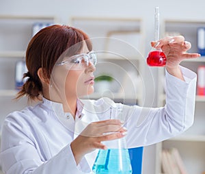 Female scientist researcher conducting an experiment in a labora