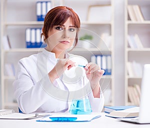 Female scientist researcher conducting an experiment in a labora