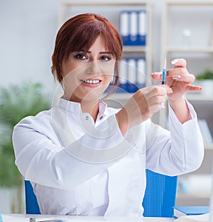 Female scientist researcher conducting an experiment in a labora