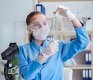 Female scientist researcher conducting an experiment in a labora