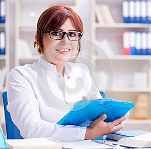 Female scientist researcher conducting an experiment in a labora