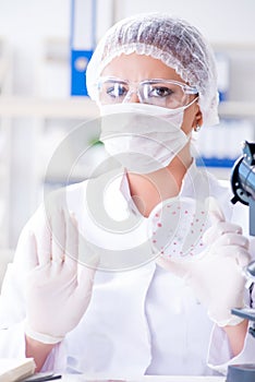 Female scientist researcher conducting an experiment in a labora