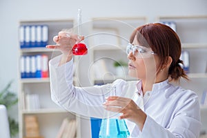 Female scientist researcher conducting an experiment in a labora