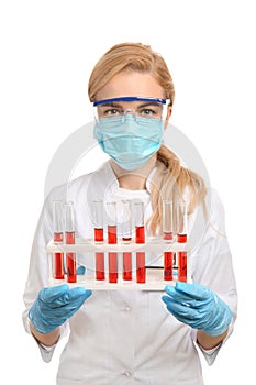 Female scientist with test tubes in holder on white background