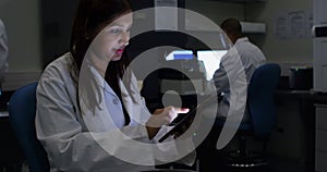 Female scientist using digital tablet 4k