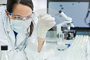 Female Scientist or Woman Doctor With Test Tube In Laboratory