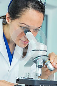 Female Scientist Woman Researcher and Microscope in Laboratory