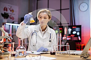 Female scientist working in modern lab. Doctor making microbiology research.