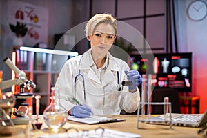 Female scientist working in modern lab. Doctor making microbiology research.