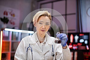 Female scientist working in modern lab. Doctor making microbiology research.