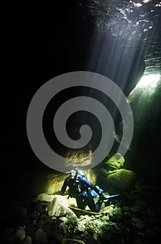 A Female Scuba Diver Basks in the Sun Rays at Heber River on Vancouver Island