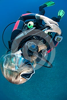 Female scuba diver with hair obscuring her face