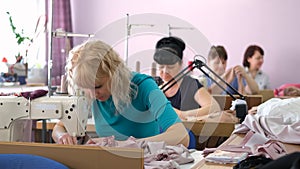 Female Seamstresses Sewing with Sewing Machines