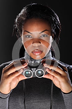 Female secret agent spy holding binoculars