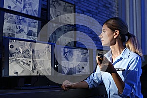 Female security guard with portable transmitter m