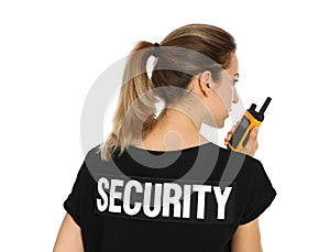 Female security guard in uniform using portable radio transmitter