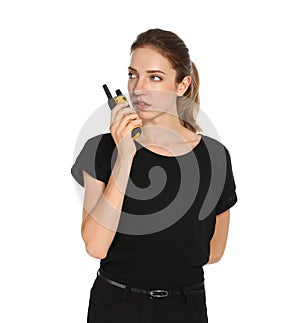 Female security guard in uniform using portable radio transmitter on background