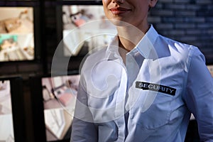 Female security guard wearing uniform at workplace