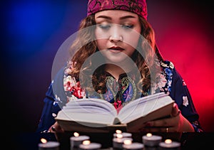 Female seer teller doing psychic reading book