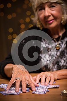 Female seer using tarot cards photo