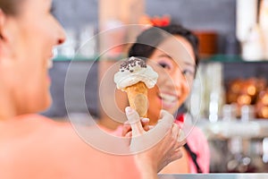 Female seller in Parlor with ice cream cone