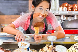 Female seller in Parlor with ice cream cone photo