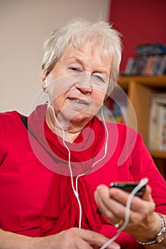 Female senior is listen musik
