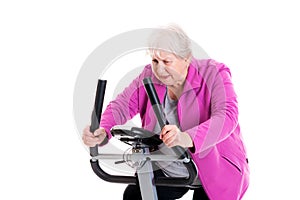 Female senior with thumb up train with fitness machine