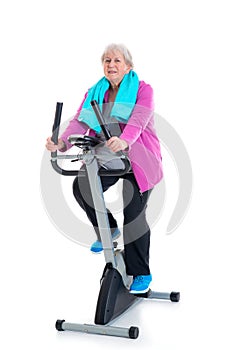 Female senior train with fitness machine