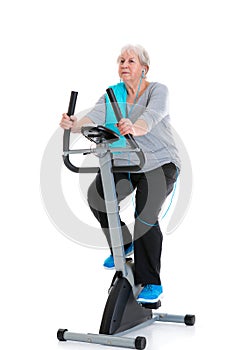 Female senior train with fitness machine