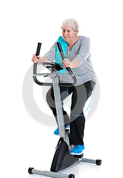 Female senior train with fitness machine